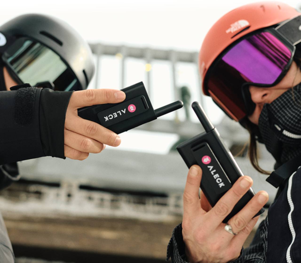 Skiers using Aleck Off Grid walkie-talkie devices to connect on the same channel