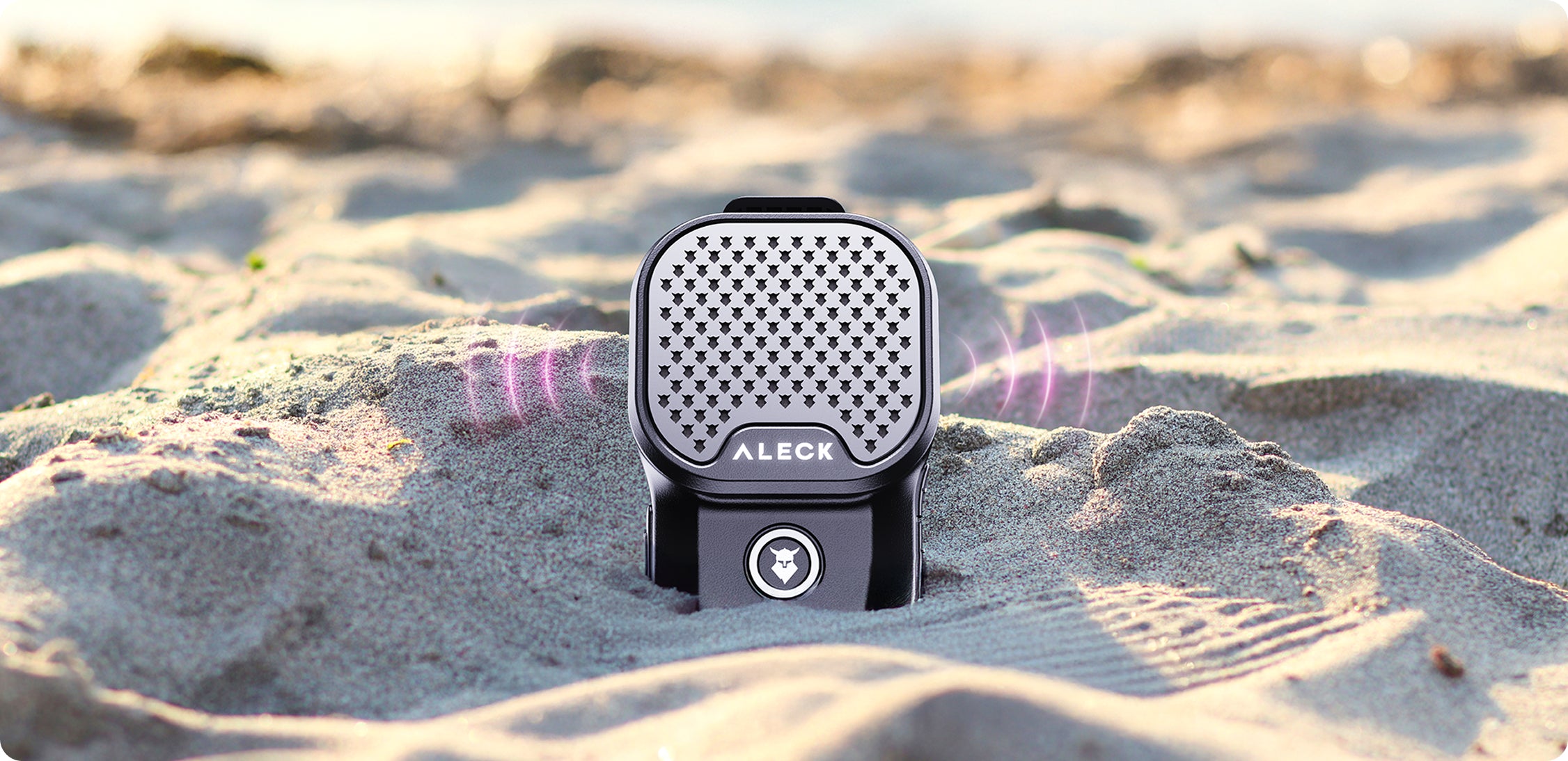 Aleck ROX Bluetooth speaker playing sound in the sand