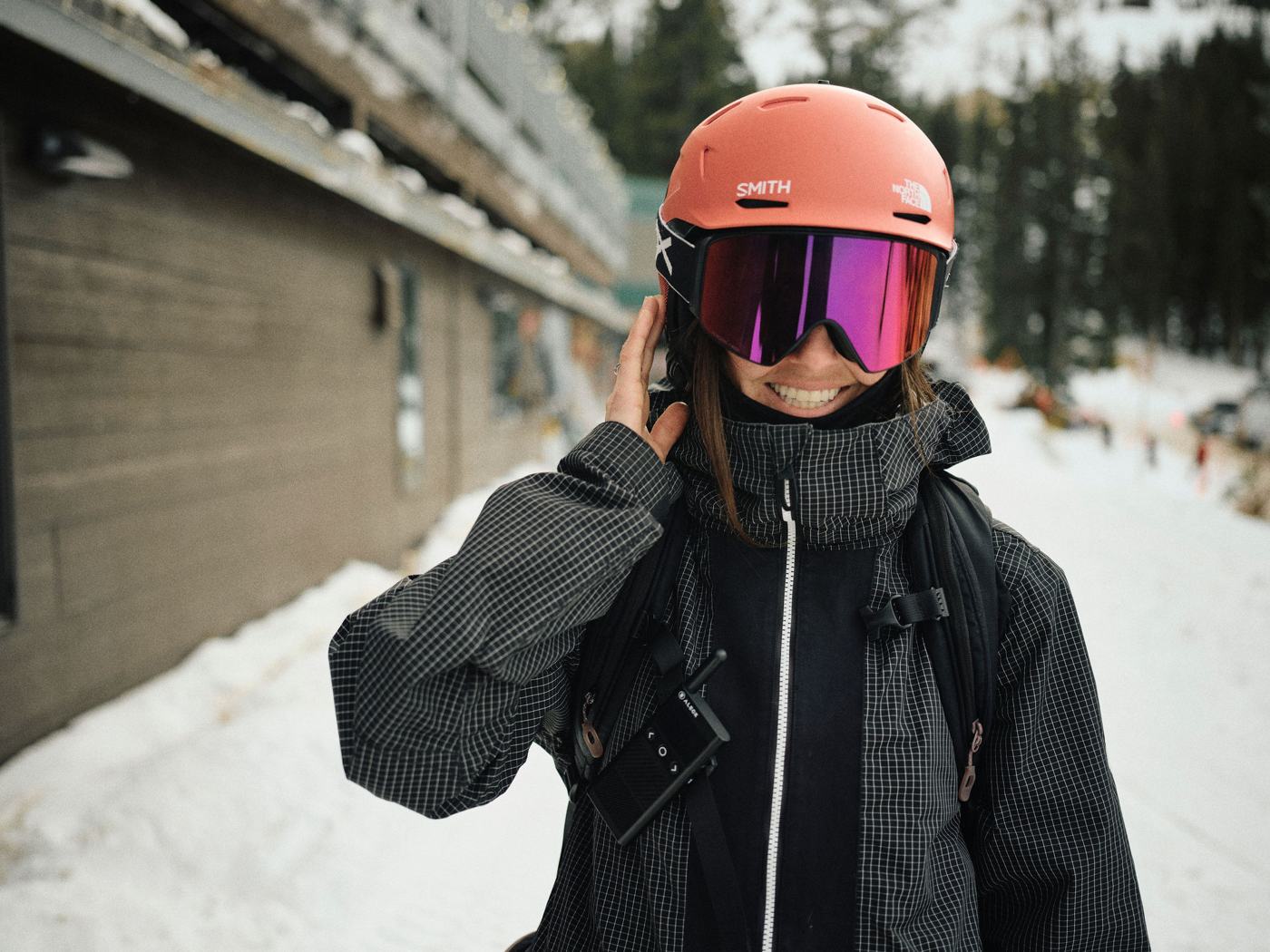 Rider with Off Grid on her pack strap