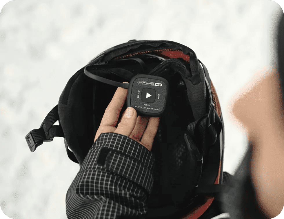Speakers dropping into a snow helmet