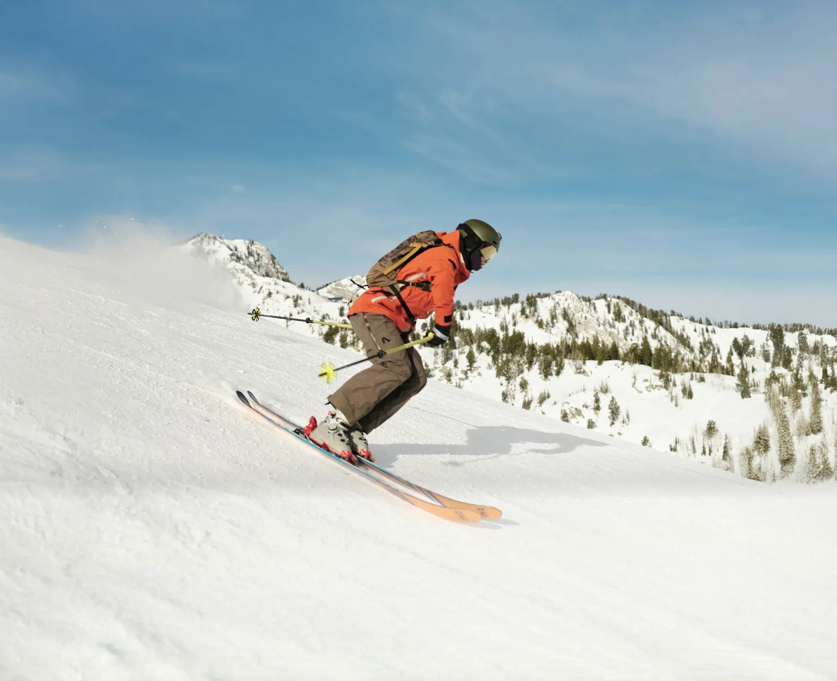 Snowboarder traversing a bright slope