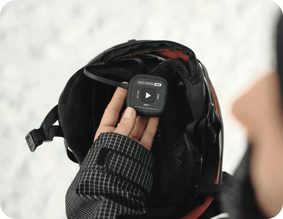 Speakers dropping into a snow helmet