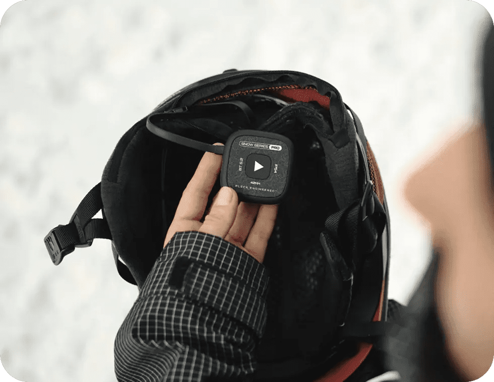 Speakers dropping into a snow helmet