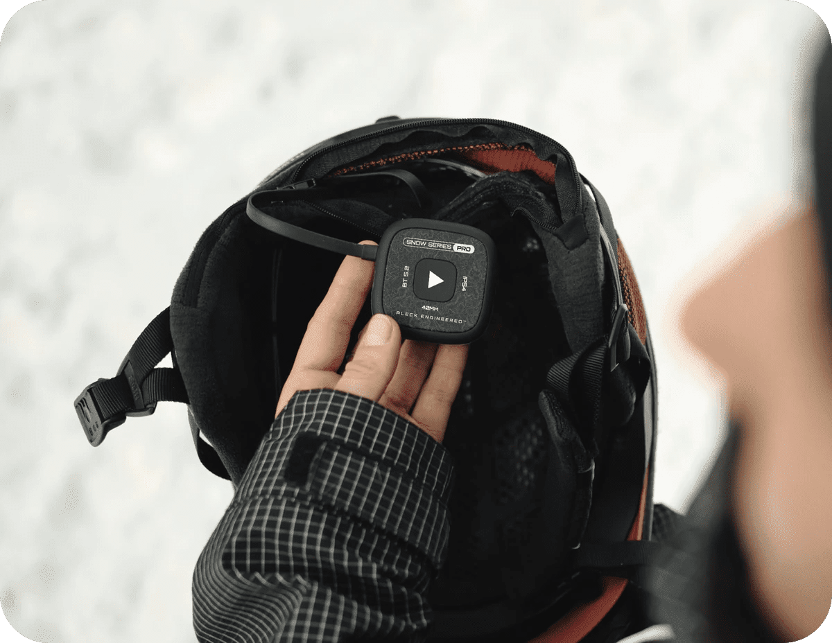 Speakers dropping into a snow helmet